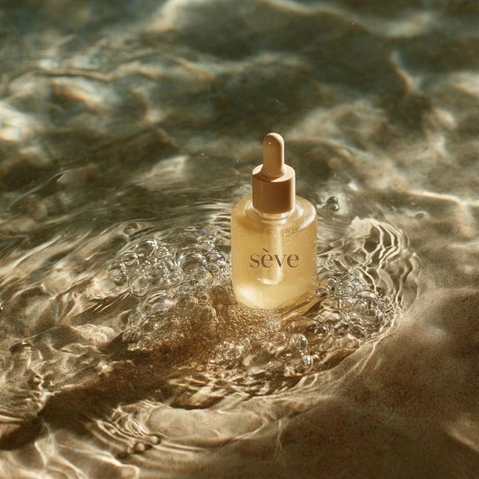Sève serum bottle resting in sunlit water